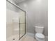 Bright bathroom featuring a white shower and toilet, exuding a clean and simple design at 349 Mentor Rd, Summerville, SC 29483