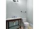 Small bathroom with a pedestal sink, toilet, and neutral colored walls at 349 Mentor Rd, Summerville, SC 29483