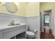 Charming bathroom with colorful sink, beadboard paneling, and classic fixtures at 349 Mentor Rd, Summerville, SC 29483