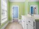 Bright bathroom with a single sink vanity, mirror and view to an adjacent room at 349 Mentor Rd, Summerville, SC 29483