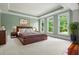 Serene bedroom with tray ceilings, multiple windows, and plush carpeting for a tranquil retreat at 349 Mentor Rd, Summerville, SC 29483