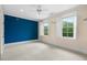 Large bedroom with natural light streaming through bright windows, featuring ceiling fan at 349 Mentor Rd, Summerville, SC 29483