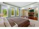 Relaxing bedroom showcasing tray ceilings, recessed lights, hardwood floors and a fireplace at 349 Mentor Rd, Summerville, SC 29483