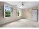 Bright bedroom with inspirational writing on the walls, featuring multiple windows and a ceiling fan at 349 Mentor Rd, Summerville, SC 29483