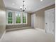 Neutral-toned bedroom with recessed lights, multiple windows, and crown molding details at 349 Mentor Rd, Summerville, SC 29483