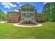 Beautiful two-story brick home featuring a manicured lawn and mature landscaping at 349 Mentor Rd, Summerville, SC 29483
