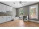 Spacious laundry room featuring white cabinets, tile flooring, and natural light at 349 Mentor Rd, Summerville, SC 29483
