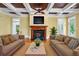 Inviting living room with cozy fireplace, coffered ceilings, and comfortable seating arrangement at 349 Mentor Rd, Summerville, SC 29483