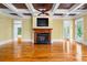 Inviting living room featuring coffered ceilings, fireplace, and open layout to adjacent rooms at 349 Mentor Rd, Summerville, SC 29483