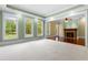 Bright living room featuring a fireplace, recessed lighting, and large windows that overlook the outdoor landscape at 349 Mentor Rd, Summerville, SC 29483