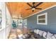 Spacious back porch featuring comfortable seating, fan, and tongue and groove ceiling at 3683 Hilton Dr, Johns Island, SC 29455