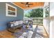 Comfortable back porch offers outdoor seating, ceiling fans, and a wood ceiling at 3683 Hilton Dr, Johns Island, SC 29455