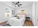 Comfortable bedroom with natural light, ceiling fan, and stylish bedside tables at 3683 Hilton Dr, Johns Island, SC 29455