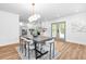 Open-concept dining area adjacent to the kitchen with modern lighting and decor at 3683 Hilton Dr, Johns Island, SC 29455