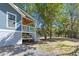 View of house from backyard, featuring a porch and green landscaping at 3683 Hilton Dr, Johns Island, SC 29455