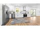 Bright kitchen featuring stainless steel appliances and white cabinets with gold hardware at 3683 Hilton Dr, Johns Island, SC 29455