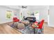 Bright living room featuring hardwood floors, neutral paint, modern furniture, and several windows at 3683 Hilton Dr, Johns Island, SC 29455