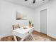 Bright home office features a white desk, modern artwork and a complementary neutral rug at 3683 Hilton Dr, Johns Island, SC 29455