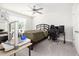 Bright bedroom with plush carpeting, ceiling fan and ample space for desk at 3718 Sandy Gate Ln, Mount Pleasant, SC 29466