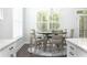 Bright dining area featuring a chandelier, a round table, and natural light from the windows at 3718 Sandy Gate Ln, Mount Pleasant, SC 29466