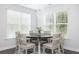 Cozy dining area featuring a chandelier, a round table, and large windows at 3718 Sandy Gate Ln, Mount Pleasant, SC 29466