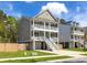 Charming two-story home features a double porch and a well-manicured lawn with a great location at 3718 Sandy Gate Ln, Mount Pleasant, SC 29466