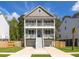 Charming two-story home features a double porch and a well-manicured lawn for a great curb appeal at 3718 Sandy Gate Ln, Mount Pleasant, SC 29466