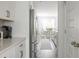 Hallway view looking from kitchen, highlighting the stainless steel appliances at 3718 Sandy Gate Ln, Mount Pleasant, SC 29466