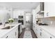 Bright kitchen features white cabinetry, stainless steel appliances, and a stylish faucet at 3718 Sandy Gate Ln, Mount Pleasant, SC 29466