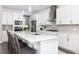Modern kitchen with white cabinets, stainless steel appliances, and an island with seating at 3718 Sandy Gate Ln, Mount Pleasant, SC 29466