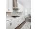 Kitchen showcasing gas range, stone backsplash, and white countertops at 3718 Sandy Gate Ln, Mount Pleasant, SC 29466
