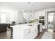 Island kitchen with stainless steel appliances, white cabinetry and hardwood floors at 3718 Sandy Gate Ln, Mount Pleasant, SC 29466