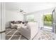 Open living area with plush seating and a sliding glass door to a balcony at 3718 Sandy Gate Ln, Mount Pleasant, SC 29466