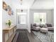 Elegant living room with modern decor, hardwood floors, and comfortable seating, bathed in natural light at 3718 Sandy Gate Ln, Mount Pleasant, SC 29466