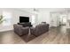 Spacious living room with hardwood floors, cozy furniture, and a ceiling fan at 3718 Sandy Gate Ln, Mount Pleasant, SC 29466