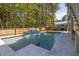 Relaxing pool with a waterfall feature and a spacious deck, perfect for outdoor gatherings at 3718 Sandy Gate Ln, Mount Pleasant, SC 29466