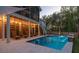 Relaxing backyard pool area with lounge chairs and ambient lighting at 3718 Sandy Gate Ln, Mount Pleasant, SC 29466