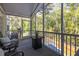 Inviting screened porch with wicker furniture, providing an ideal space to relax and enjoy the outdoors at 3718 Sandy Gate Ln, Mount Pleasant, SC 29466