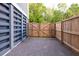 Side yard area with double door access, enclosed by wooden fence at 3718 Sandy Gate Ln, Mount Pleasant, SC 29466
