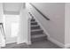Clean staircase with carpeted steps, white walls, and a simple gray handrail at 3718 Sandy Gate Ln, Mount Pleasant, SC 29466