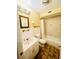 Bright bathroom with wainscoting, clean fixtures, and a shower/tub combination for practical use at 4262 Mariners Watch, Kiawah Island, SC 29455