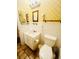 Clean bathroom with wainscotting, white vanity, and tropical wallpaper, offers a fresh and airy feel at 4262 Mariners Watch, Kiawah Island, SC 29455