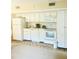 Functional kitchen features white appliances, ample cabinet space, and a bright, clean design at 4262 Mariners Watch, Kiawah Island, SC 29455