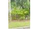 Landscaped yard with mature trees and beautiful flowering bushes at 4262 Mariners Watch, Kiawah Island, SC 29455