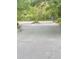 A road in a quiet neighborhood leads to an intersection surrounded by lush foliage at 4262 Mariners Watch, Kiawah Island, SC 29455