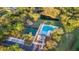 Aerial view of a community pool, tennis courts, playground, and green spaces at 4263 Hugh Bennett Dr, Johns Island, SC 29455