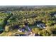 Aerial view showcasing the wooded area and neighborhood of this community at 4263 Hugh Bennett Dr, Johns Island, SC 29455