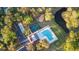 An aerial view of an outdoor pool, tennis courts, playground, and parking at 4263 Hugh Bennett Dr, Johns Island, SC 29455