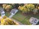 Aerial view of a home with a large lawn in a neighborhood with mature trees at 4263 Hugh Bennett Dr, Johns Island, SC 29455