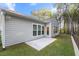 Backyard of the house with an outdoor patio with trees at 4263 Hugh Bennett Dr, Johns Island, SC 29455